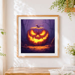 Finished glowing angry jack-o'-lantern cross stitch artwork displayed