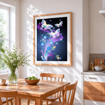 Glowing butterflies and blue flowers cross stitch artwork displayed on wall as home decor