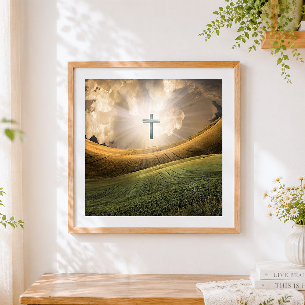 Finished glowing cross over golden fields cross stitch artwork displayed