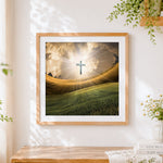 Finished glowing cross over golden fields cross stitch artwork displayed