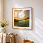Glowing cross over golden fields cross stitch artwork displayed on wall as home decor