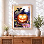 Finished lowing jack-o'-lantern and bats cross stitch artwork displayed
