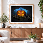 Finished glowing jack o lantern and halloween typography cross stitch artwork displayed