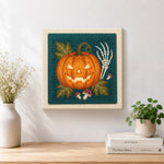 Finished glowing jack o lantern artwork displayed on a wall