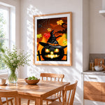 Glowing jack-o'-lantern with witch hat cross stitch artwork displayed on wall as home decor