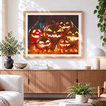 Finished glowing jack-o'-lanterns and candles cross stitch artwork displayed