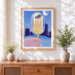 Finished glowing lollipop in the city at night cross stitch artwork displayed