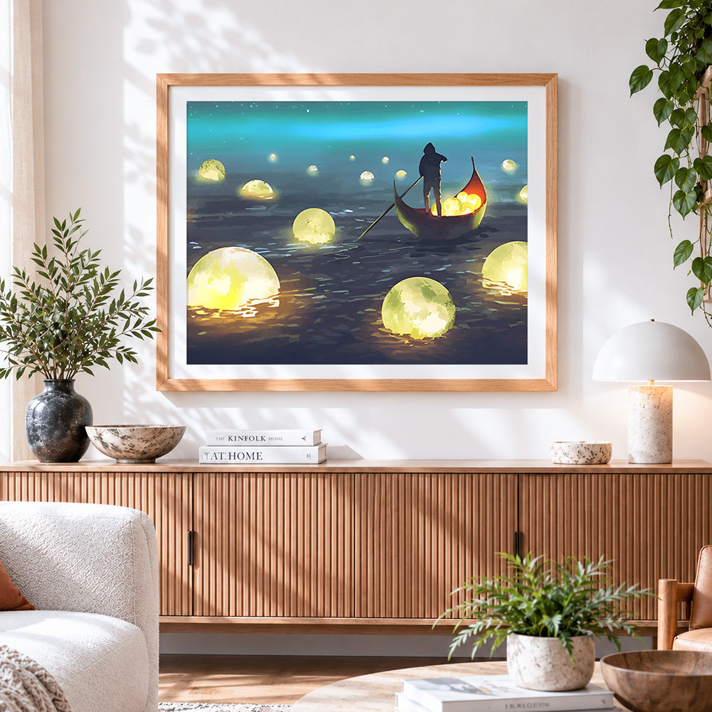 Finished glowing moons and boatman cross stitch artwork displayed
