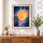 Finished glowing orange moon and tree silhouettes cross stitch artwork displayed