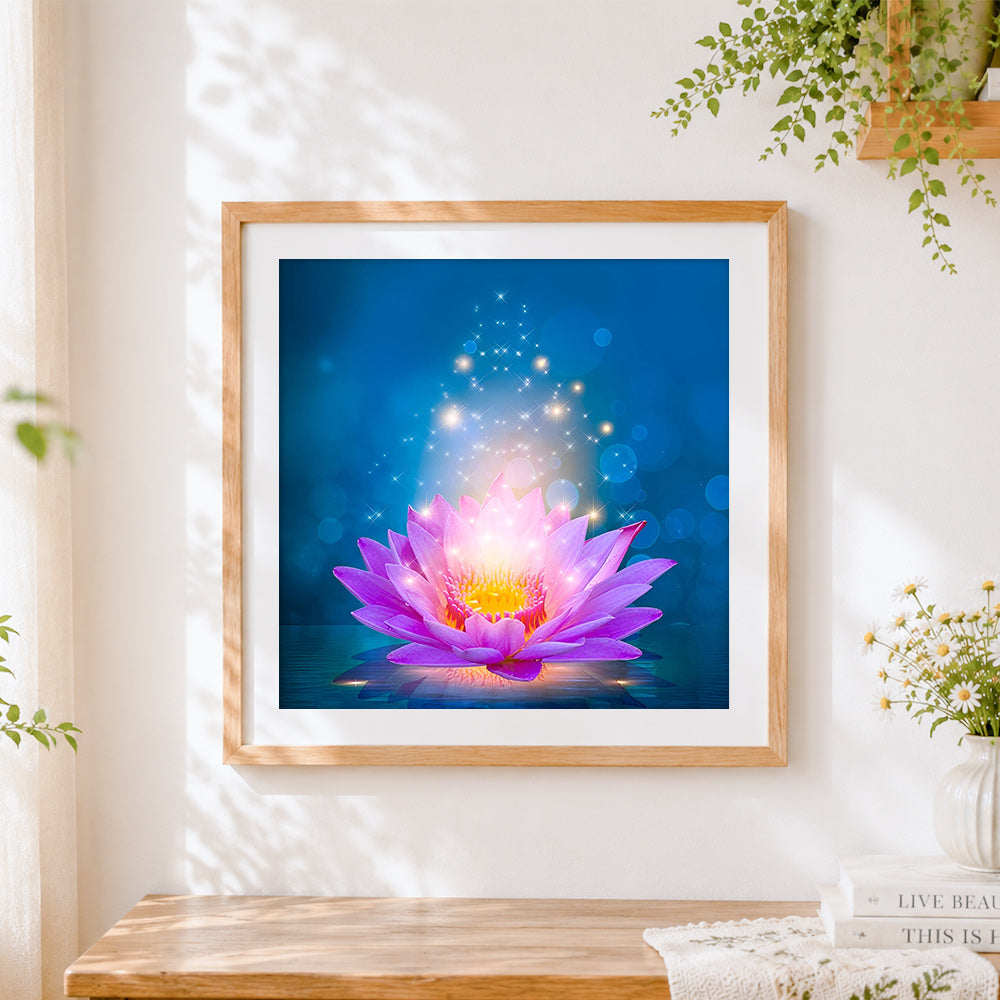 Finished glowing pink lotus flower cross stitch artwork displayed