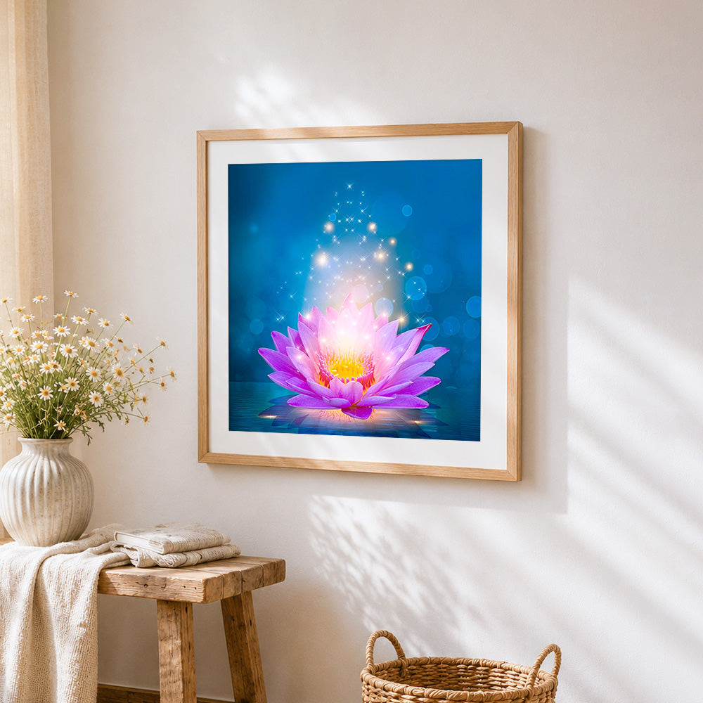 Glowing pink lotus flower cross stitch artwork displayed on wall as home decor