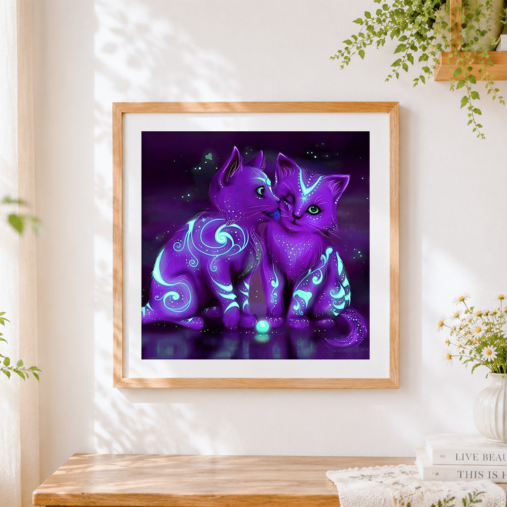 Finished glowing purple mystical cats cross stitch artwork displayed