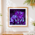 Finished glowing purple mystical cats paint by numbers artwork displayed as home decor