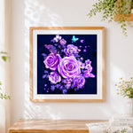 Finished glowing purple roses and butterflies cross stitch artwork displayed