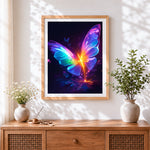 Finished glowing rainbow butterfly cross stitch artwork displayed