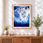 Finished glowing tiger in water cross stitch artwork displayed