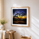 Glowing tree under starry night cross stitch artwork displayed on wall as home decor