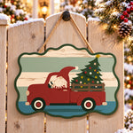 Gnome red truck trip paint by numbers door hanger on a garden gate