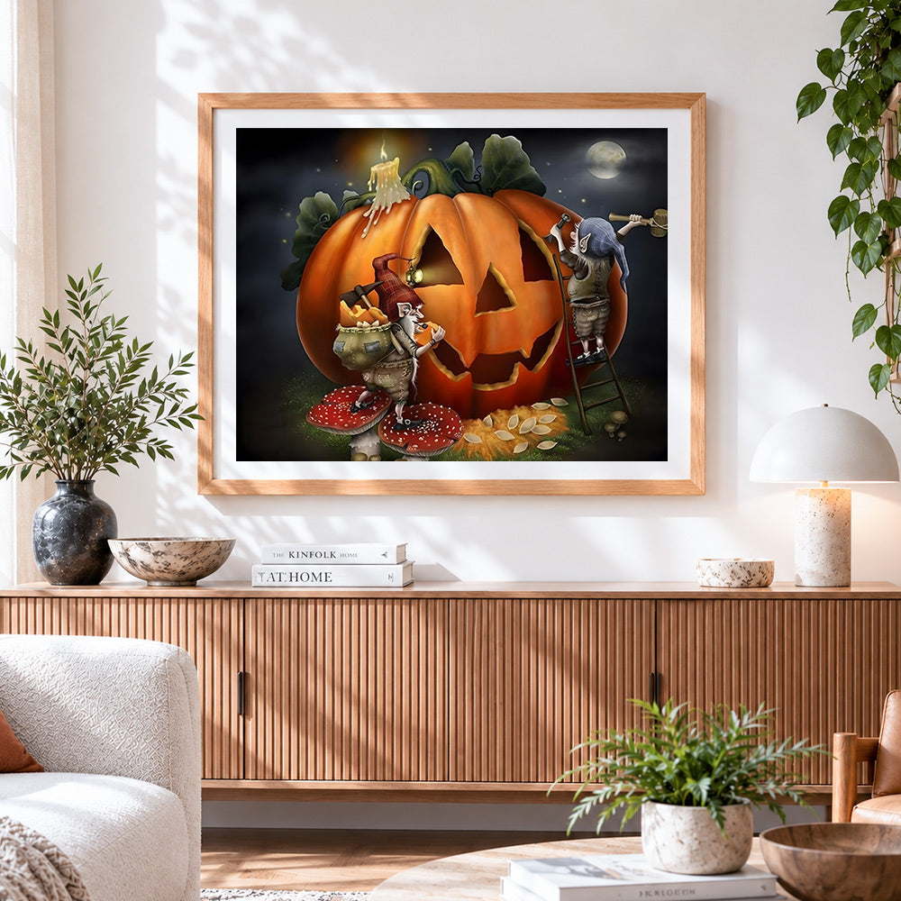 Finished gnomes carving a giant pumpkin cross stitch artwork displayed