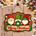 Gnomes with wreath paint by numbers door hanger on a garden gate