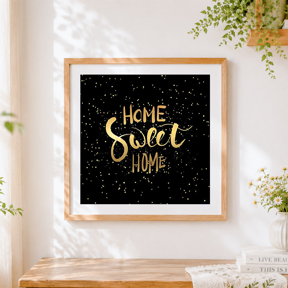 Finished gold home sweet home on black starry background cross stitch artwork displayed