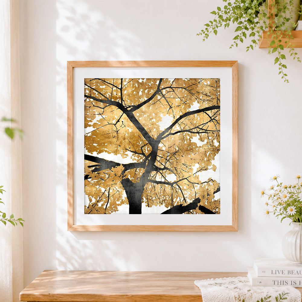 Finished golden and black tree cross stitch artwork displayed