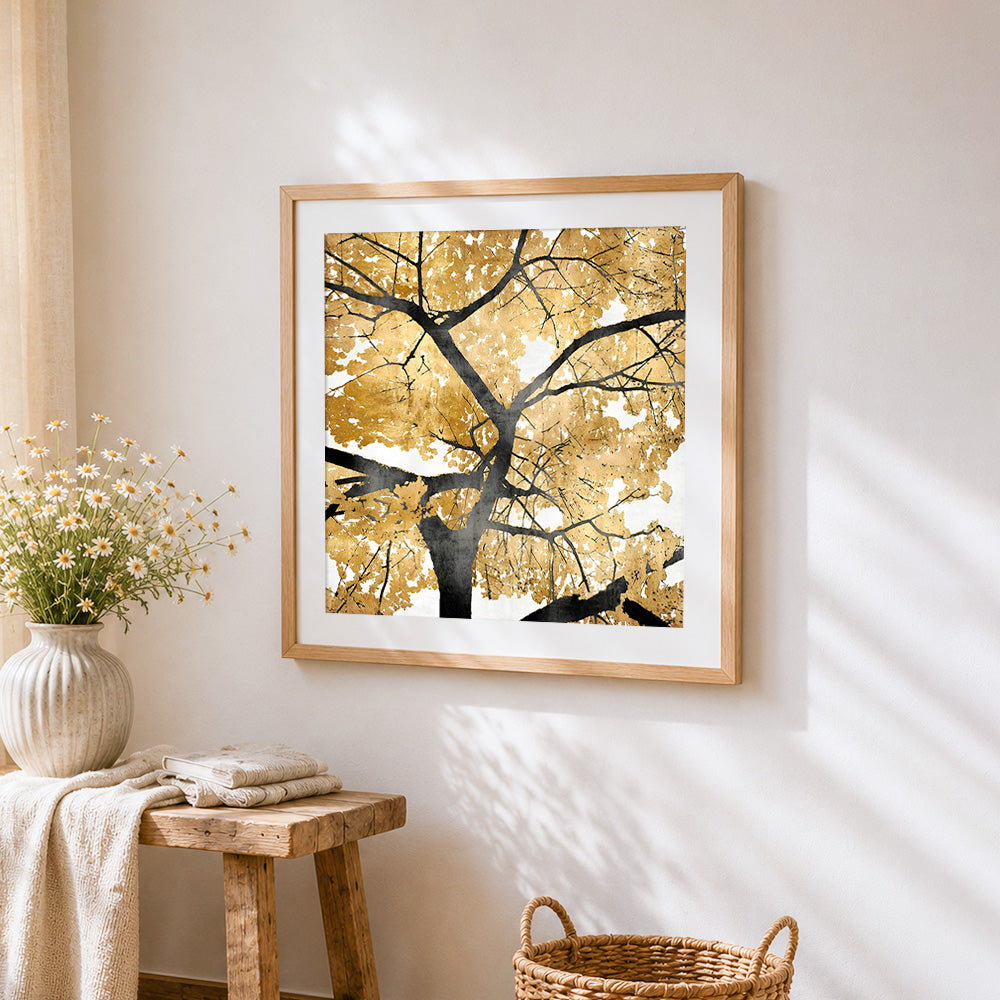 Golden and black tree cross stitch artwork displayed on wall as home decor