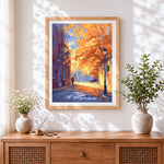 Finished golden autumn street scene cross stitch artwork displayed