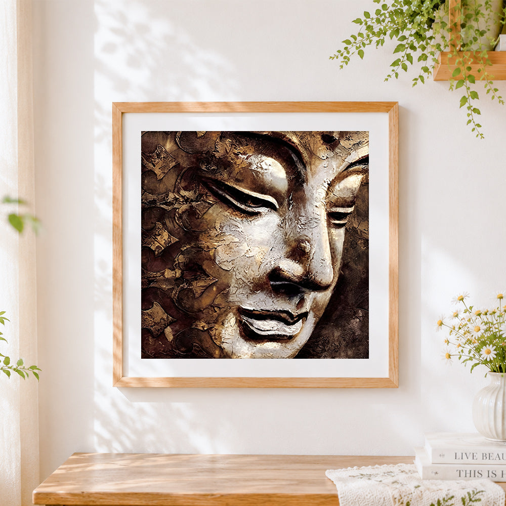 Finished golden buddha face close up cross stitch artwork displayed