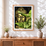 Finished golden buddha with botanical leaves cross stitch artwork displayed