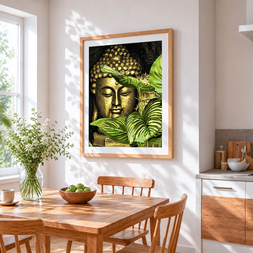 Golden buddha with botanical leaves cross stitch artwork displayed on wall as home decor