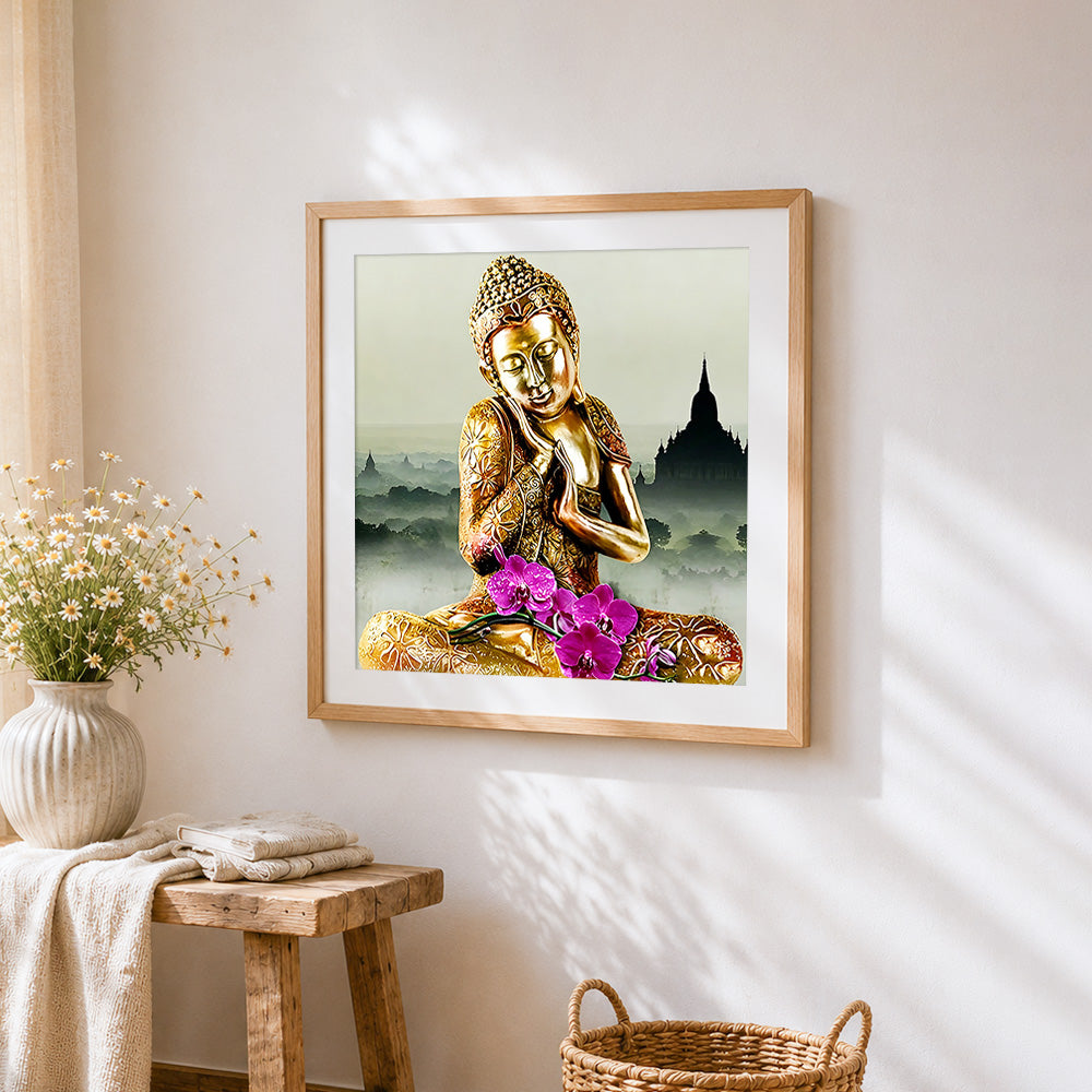 Golden buddha with purple orchids cross stitch artwork displayed on wall as home decor
