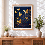 Finished golden butterflies in night sky cross stitch artwork displayed
