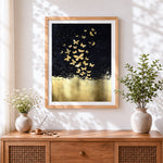Finished golden butterflies on black background cross stitch artwork displayed