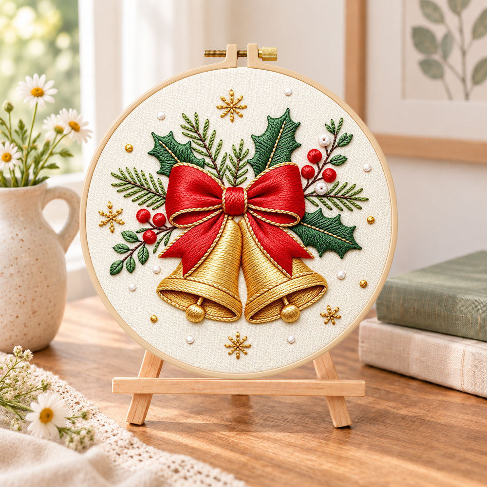 Golden christmas bells embroidery kit finished hoop displayed on a wooden stand as cosy tabletop decor