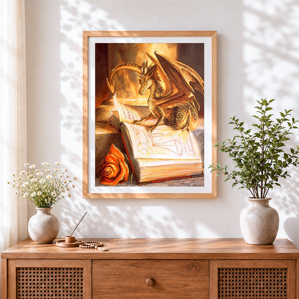 Finished golden dragon and spellbook cross stitch artwork displayed