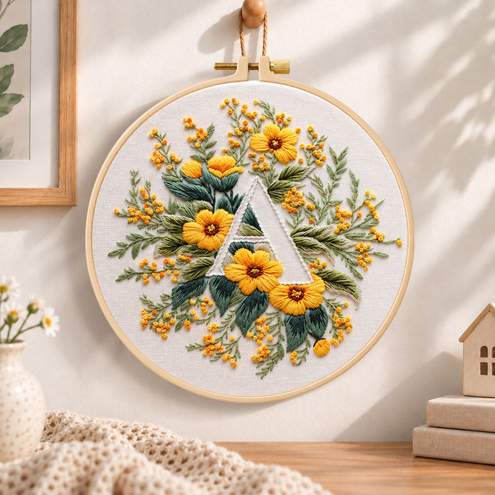 Golden florals and letter a embroidery hoop wall art displayed as warm and cosy handmade home decor