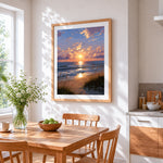 Golden hour ocean waves and dune grass cross stitch artwork displayed on wall as home decor