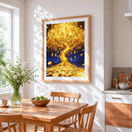 Golden money tree cross stitch artwork displayed on wall as home decor