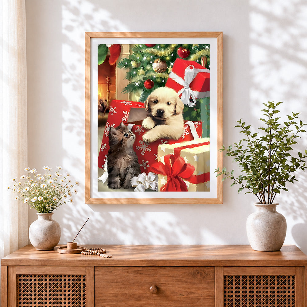 Finished golden puppy and kitten in christmas gift boxes cross stitch artwork displayed