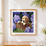 Finished golden puppy in a basket of hydrangeas cross stitch artwork displayed