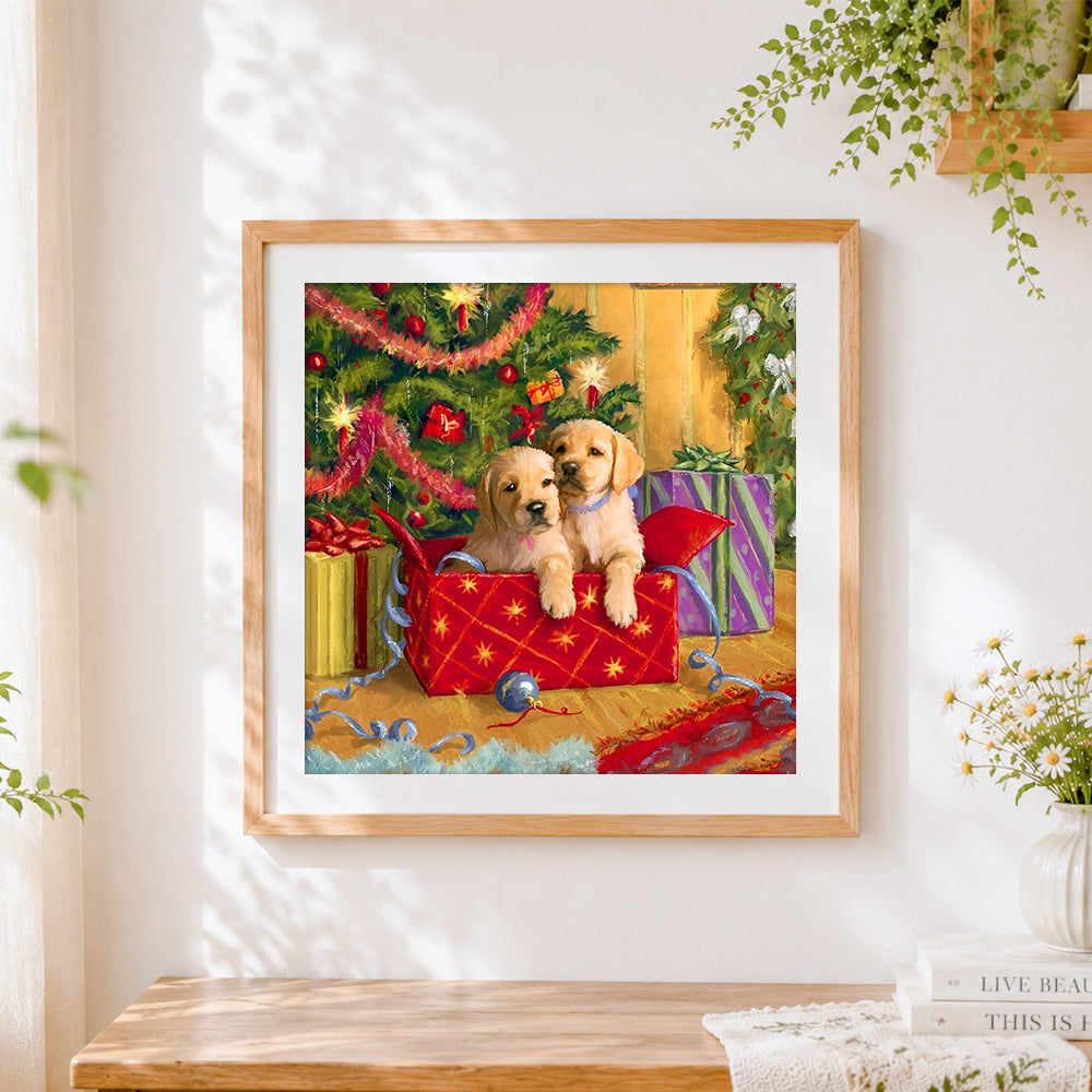 Finished golden retriever puppies in a christmas box cross stitch artwork displayed
