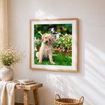 Golden retriever puppy in the garden cross stitch artwork displayed on wall as home decor