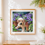 Finished golden retriever puppy with purple flowers cross stitch artwork displayed