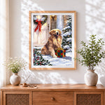 Finished golden retriever with christmas present cross stitch artwork displayed