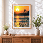 Finished golden sunset reeds silhouette cross stitch artwork displayed