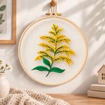 Goldenrod sprig embroidery hoop wall art displayed as warm and cozy handmade home decor