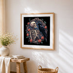 Gothic skeleton, raven and roses cross stitch artwork displayed on wall as home decor