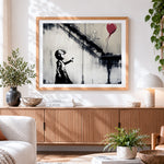 Finished graffiti girl and flying red balloon paint by numbers artwork displayed as home decor