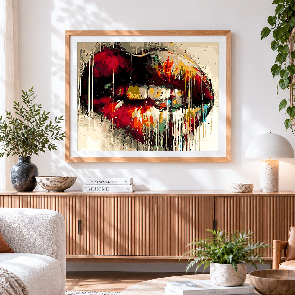 Finished graffiti red lips cross stitch artwork displayed